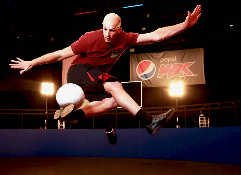 Daniel Cutting, Professional Football Freestyler and FIVE-TIME Guinness World Record Holder, performs at the launch of the Pepsi MAX Volley Arena in Essex. PRESS ASSOCIATION Photo. Picture date: Thursday April 21, 2016. Photo credit should read: Matt Alexander/PA Wire