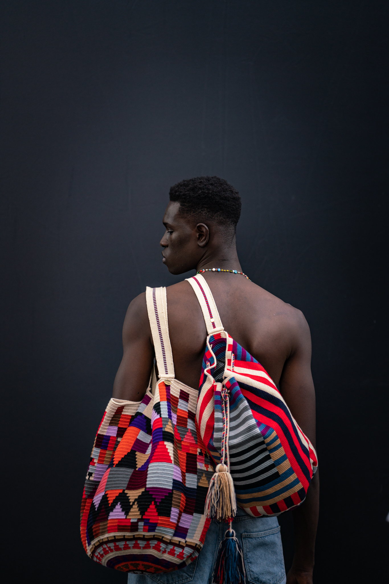 Pitti Uomo 104 - model wearing designer bags