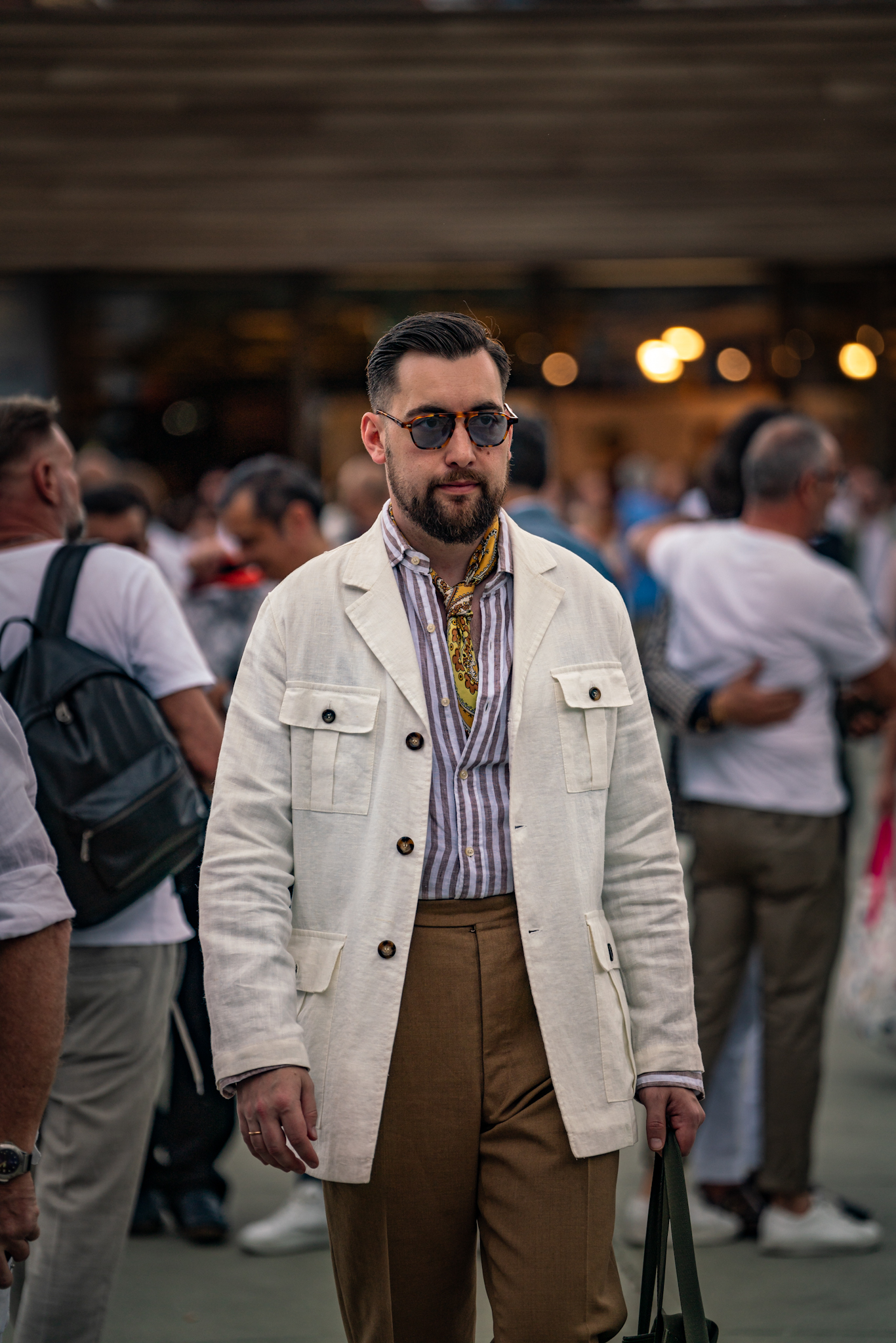 Pitti Uomo 104 - Man in cream safari jacket