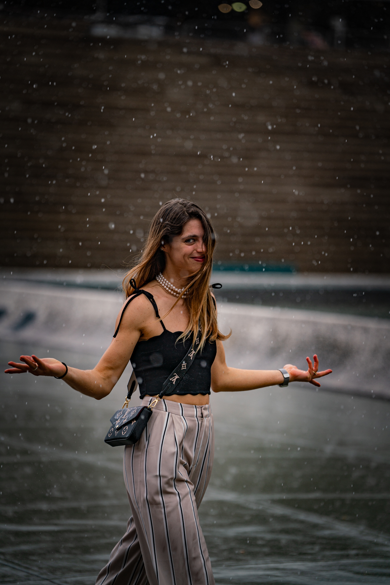 Pitti Uomo 104 - woman walking in rain