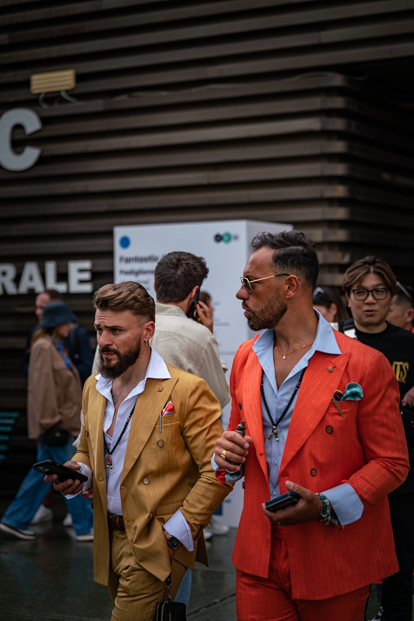 Gentlemen in red and miustard suits